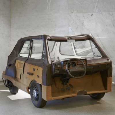A small vehicle disassembled and reassembled with the interior on the exterior